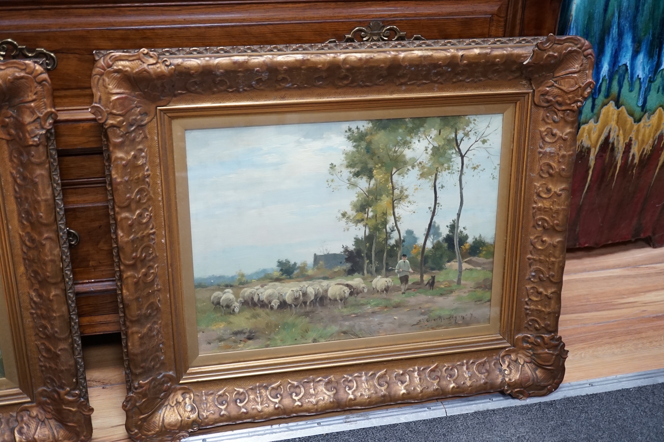 Adrianus Johannes Groenewegen (1874-1963), pair of oils on canvas, Shepherd and flock and cow herder in landscapes, signed, 32 x 43cm